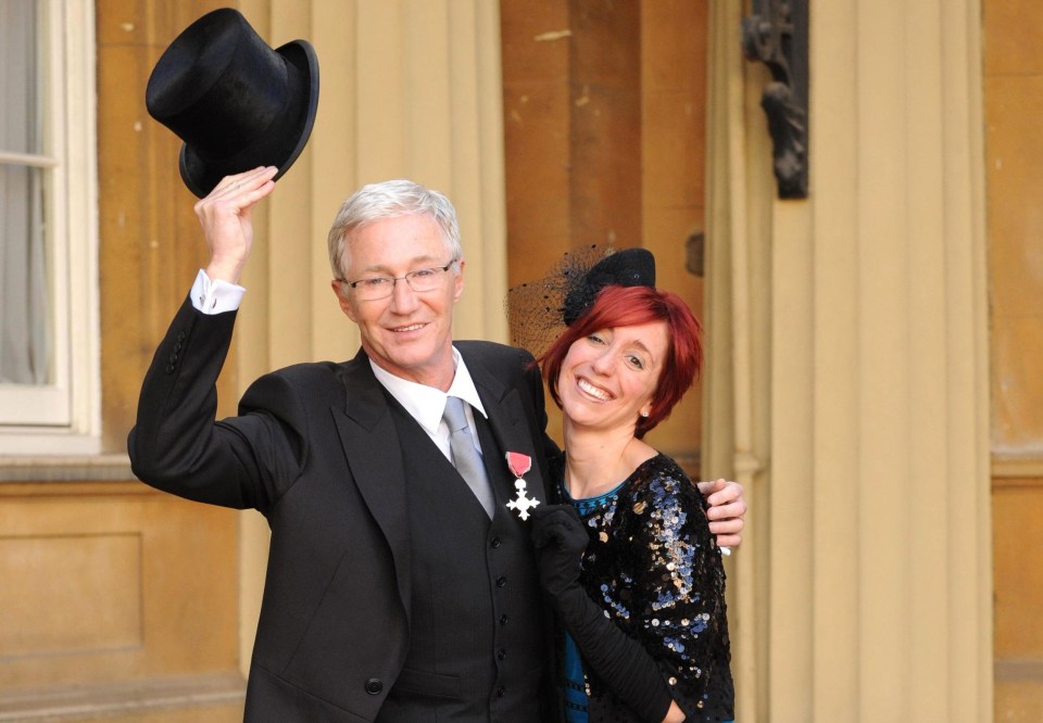 File photo dated 16/10/08 of Paul O'Grady, 53, at Buckingham Palace with daughter Sharyn Mousley, when was made a Member of the Order of the British Empire by the then Prince of Wales (now King Charles III). TV presenter and comedian Paul O'Grady has died at the age of 67, his partner Andre Portasio has said. The TV star, also known for his drag queen persona Lily Savage, died "unexpectedly but peacefully" on Tuesday evening, a statement shared with the PA news agency via a representative said. Issue date: Wednesday March 29, 2023. PA Photo. See PA story DEATH OGrady. Photo credit should read: Fiona Hanson/PA Wire