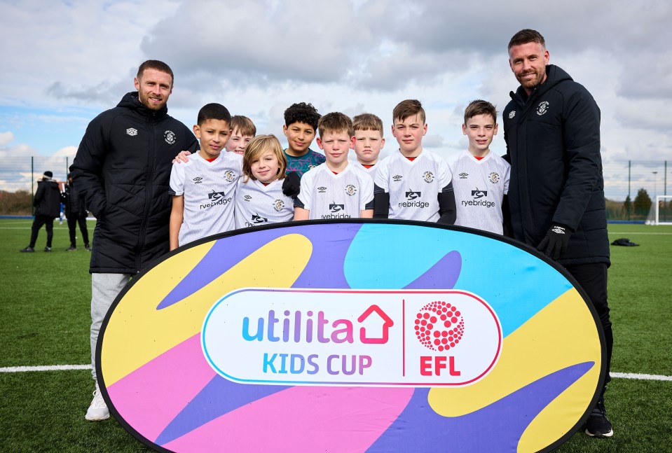 Rob Edwards and Luton star Jordan Clark with the Luton U11s team