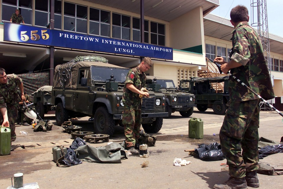 Soldiers pack up equipment in Freetown, Sierra Leone, in 2000