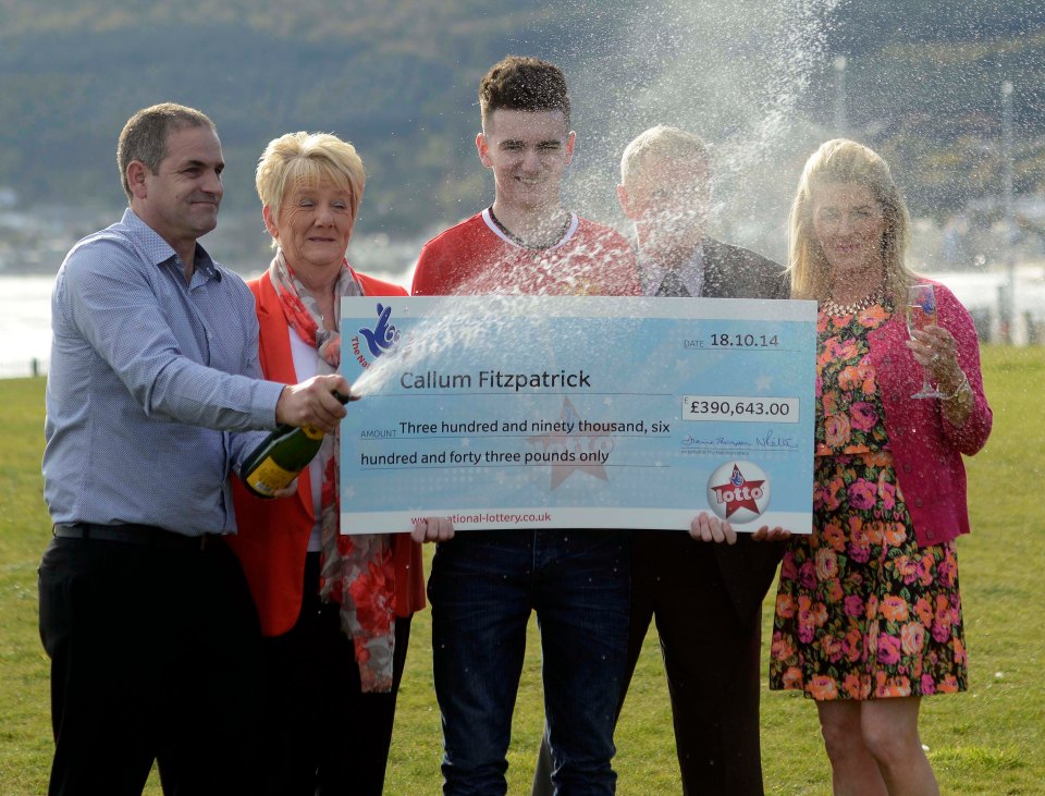 Callum with his parents Sheila and Colin as he scooped up his impressive win