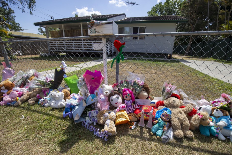 A makeshift memorial was made outside of their home