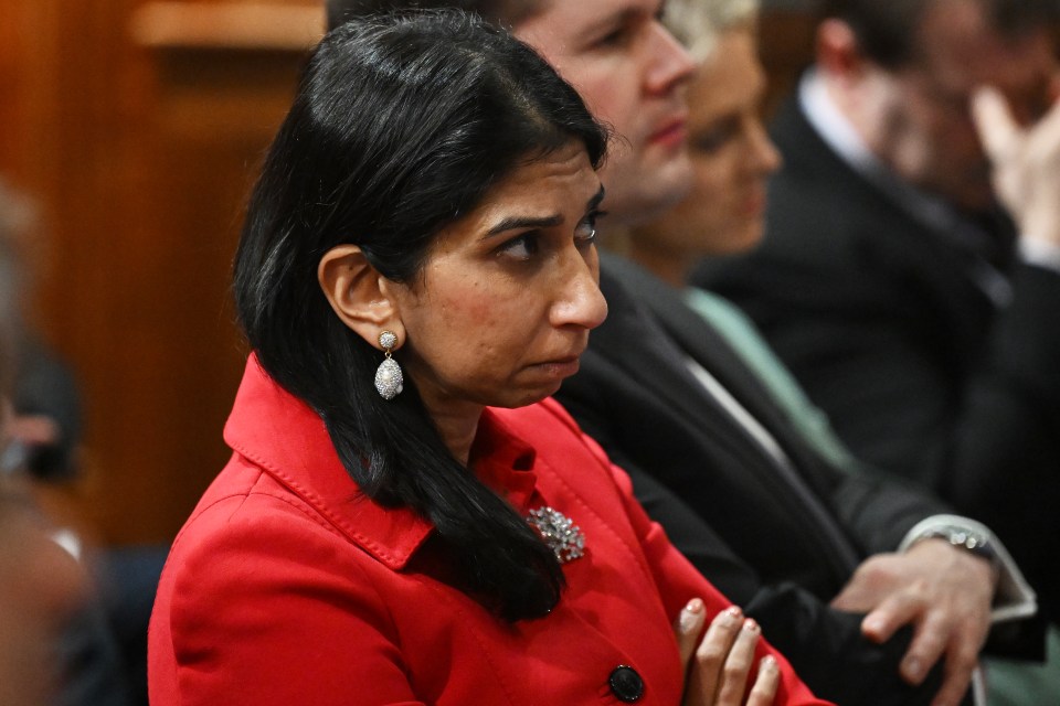 Home Secretary Suella Braverman listens as Prime Minister Rishi Sunak speaks during a press conference