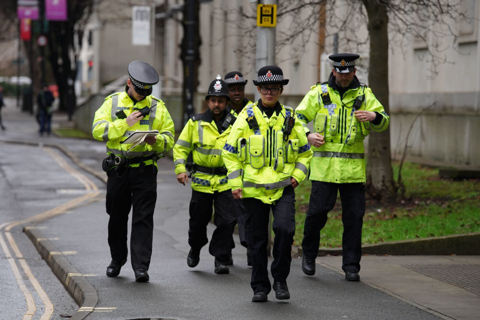 Police officers outside Manchester Crown Court before Cashman arrived