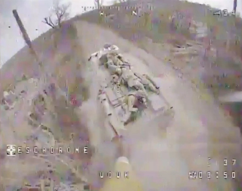 Footage shows a Ukrainian drone closing in on a Russian armoured vehicle