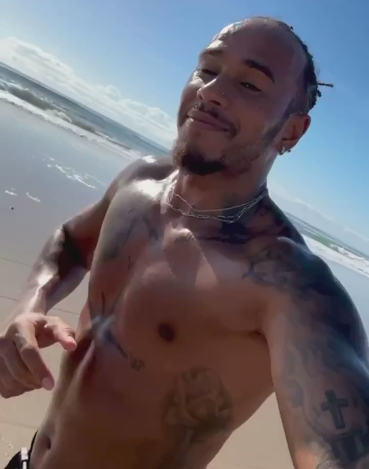 Rpped racer Lewis Hamilton worked out on a beach in Australia as he sent a message to followers