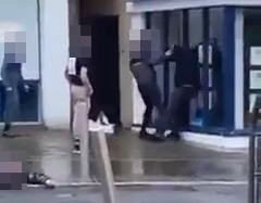 The three thugs took turns to land punches on the man