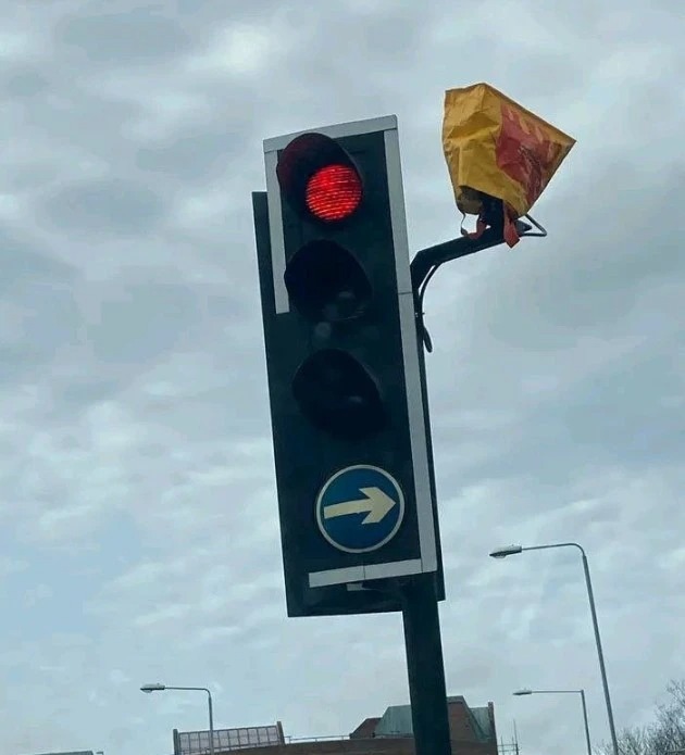 Another camera has been covered up with a Sainsbury's bag for life