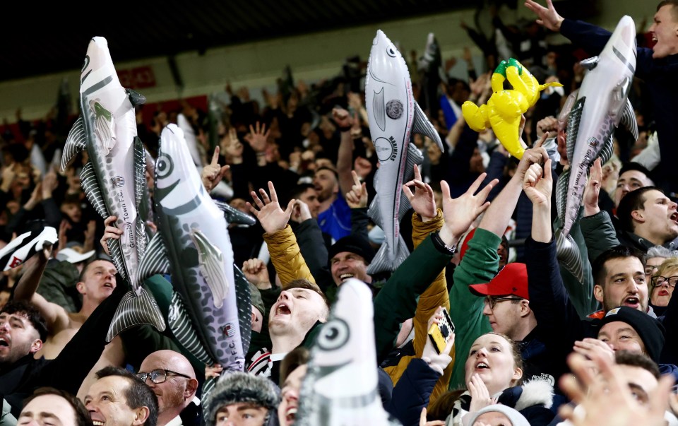 Grimsby fans celebrate with their inflatable fish