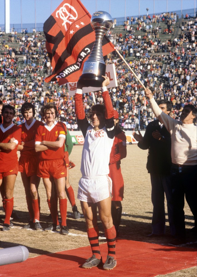 Flamengo's Zico lifts the Club World Cup trophy