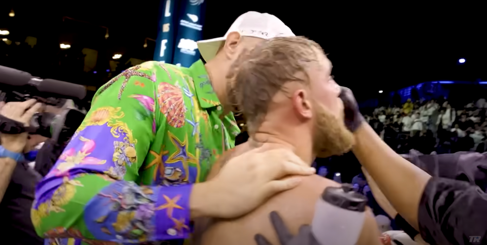 Tyson Fury embracing with Jake Paul