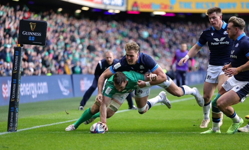 Jack Conan of Ireland scores the team's third try whilst being tackled by Duhan van der Merwe of Scotland during the Six Nations Rugby match between Scotland and Ireland