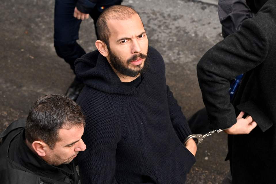 Tate arrives to the court in handcuffs on February 1