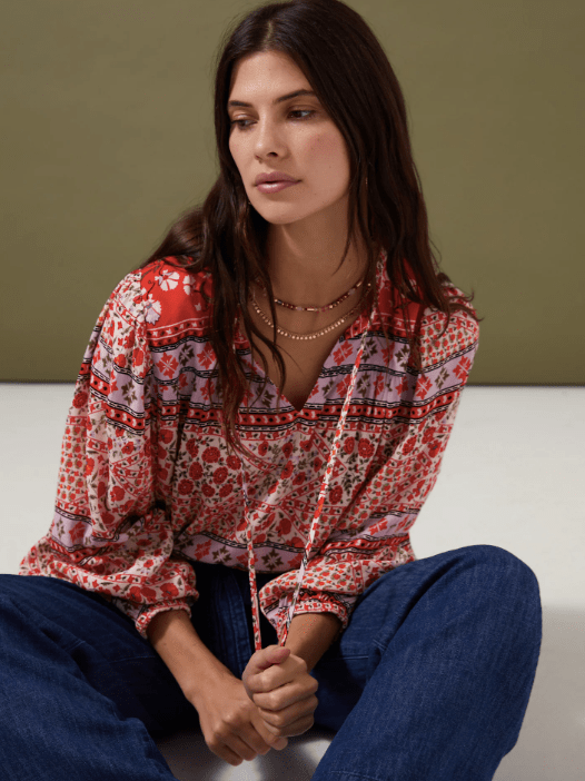 Add a pop of colour to your 70s look with this floral print blouse