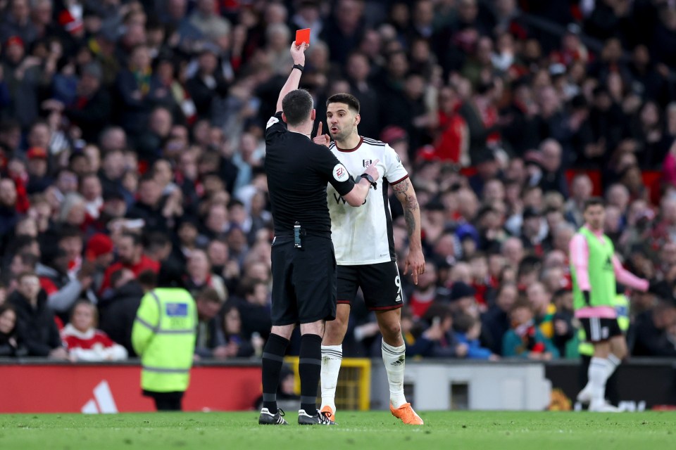 Aleksandar Mitrovic was shown a red card after putting his hands on the ref