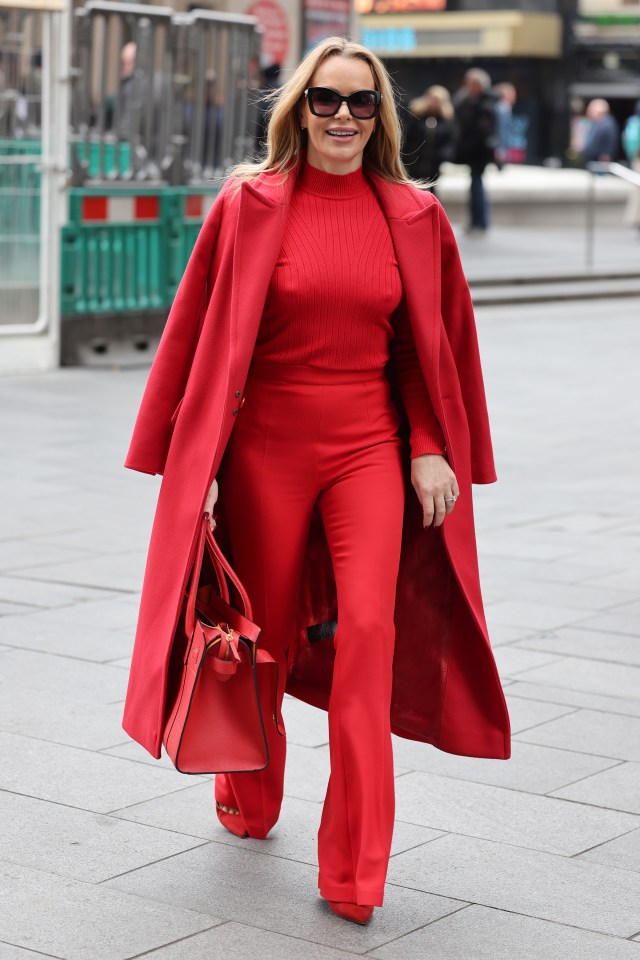 Amanda Holden looked stunning as she went braless in an all-red outfit