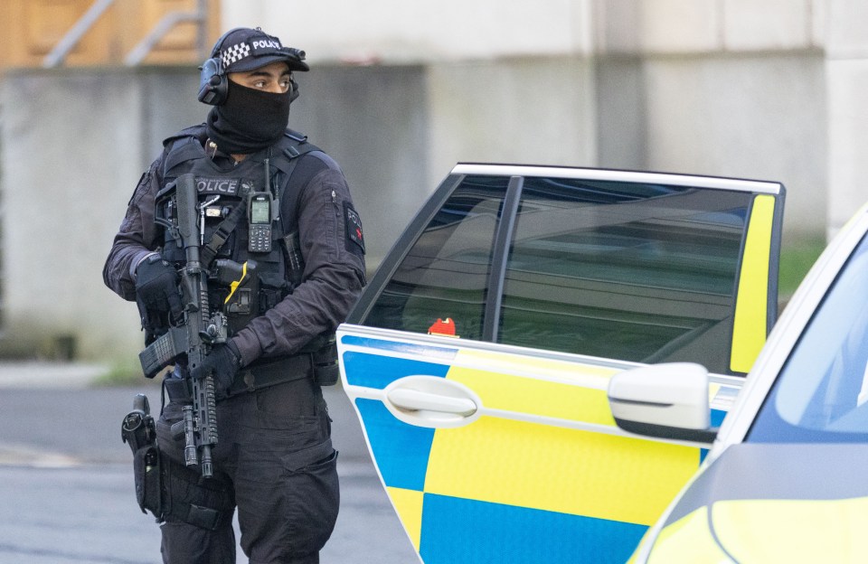 Armed police escorted a van - believed to be containing Cashman - to Manchester Crown Court this morning