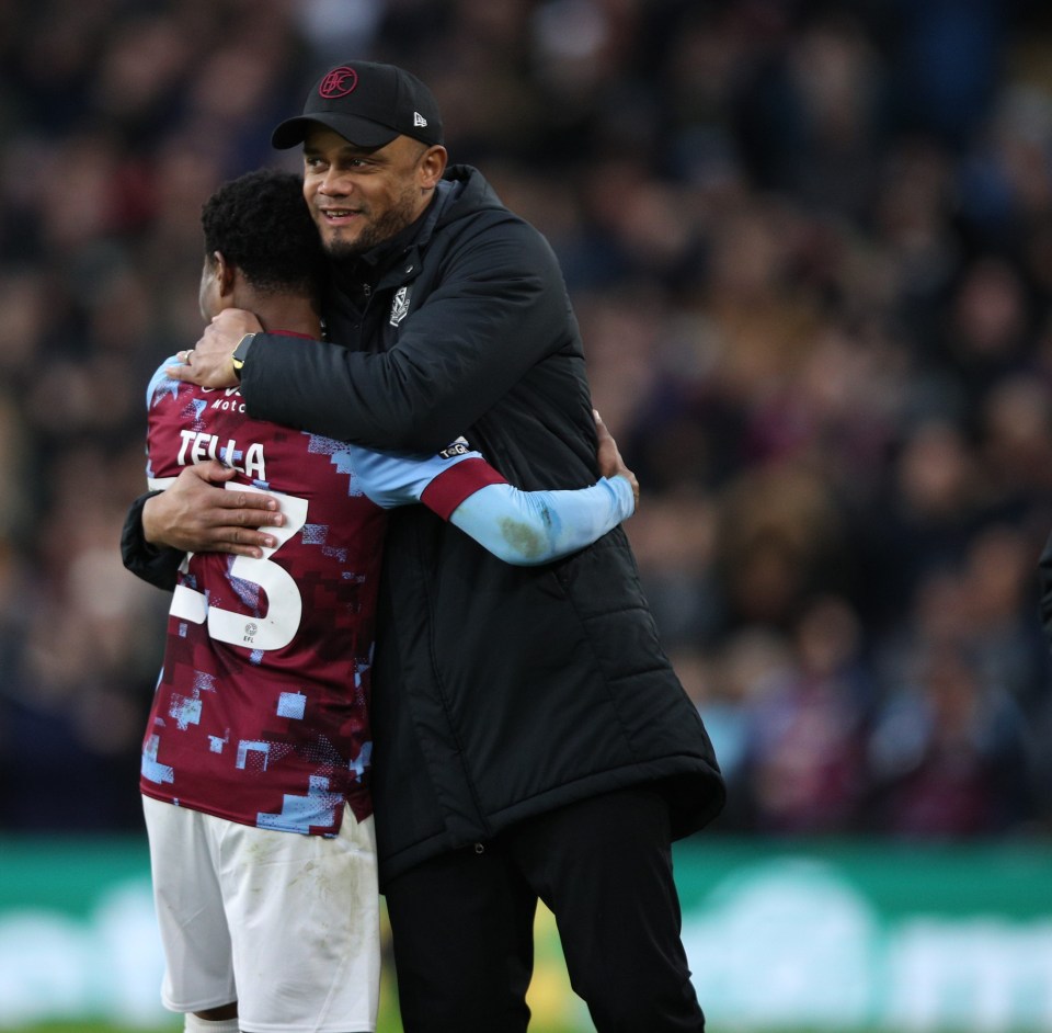 Vincent Kompany with Nathan Tella