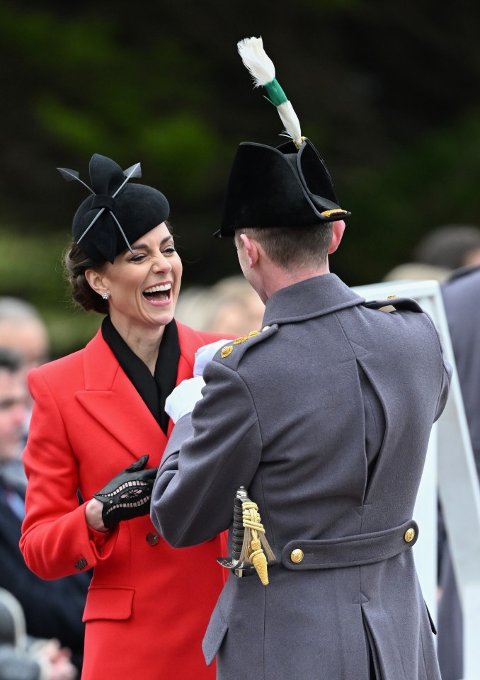 Kate laughs with a member of the 1st Battalion Welsh Guards