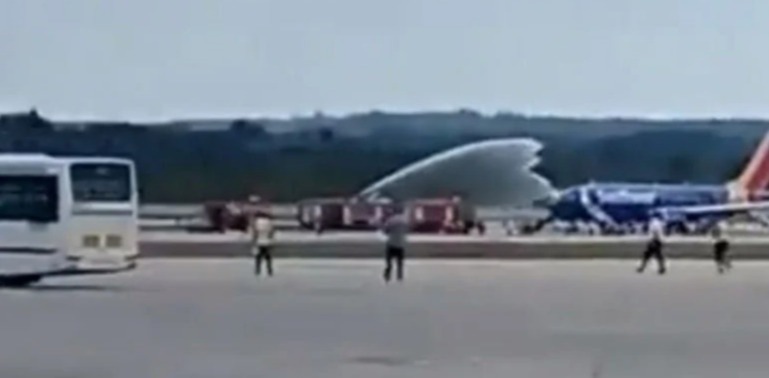 The plane is doused with water after it was forced to return to Havana's airport