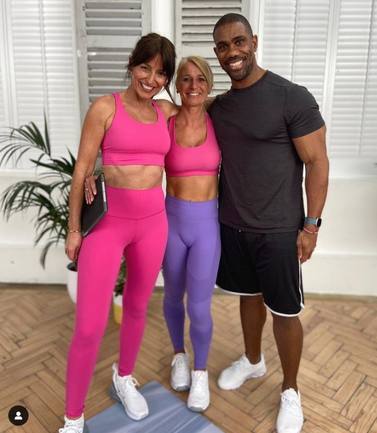 Davina McCall showed off her chiselled tanned six pack with her fitness colleagues