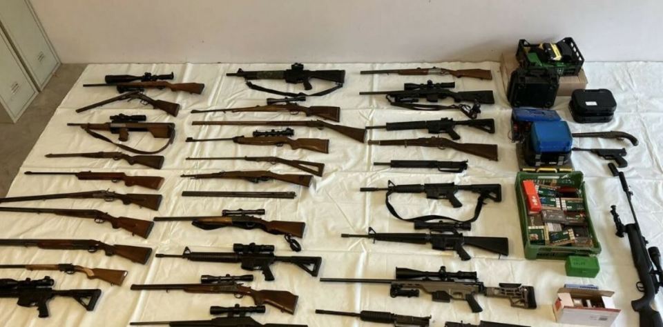 70 guns have been found at a house in Austria, leading to the arrest of two Brits