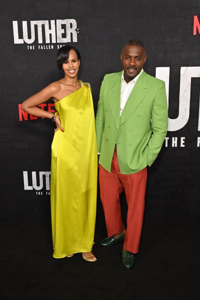 Idris Elba and wife Sabrina add a splash of colour to contrast with the darkness of his latest film