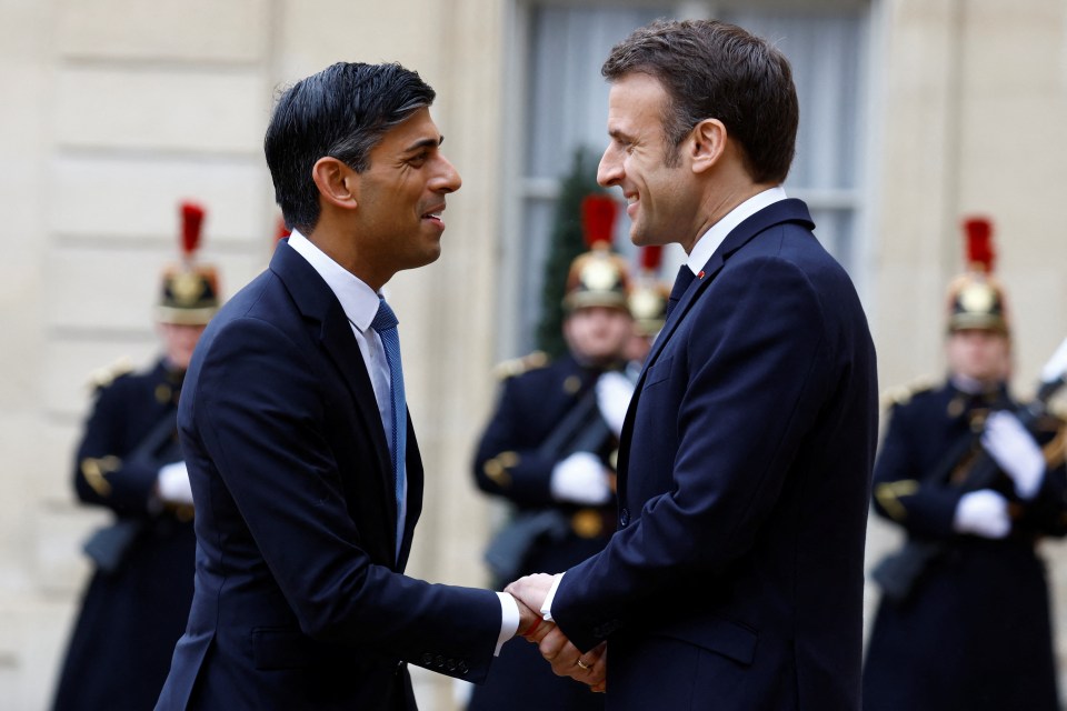 British PM Rishi Sunak shakes hands with French President Emmanuel Macron