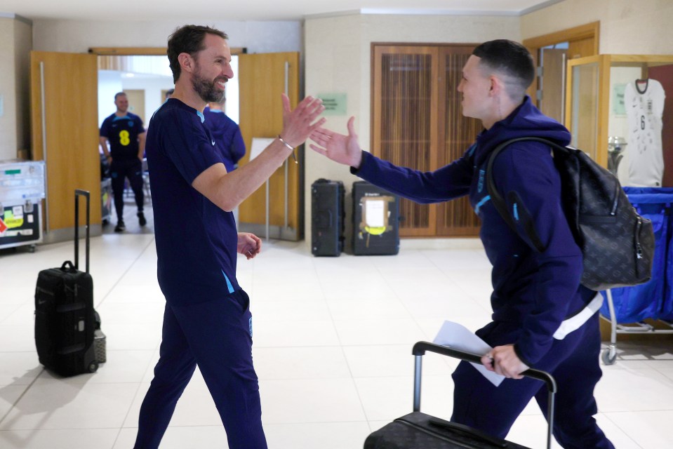 England boss Gareth Southgate greets Phil Foden