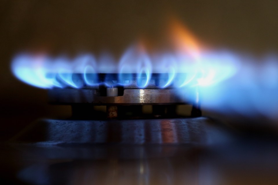 Gas And Oil Concept. Energy Crisis. Blue Flame Of Gas Stove Top