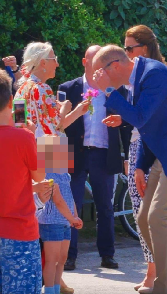 The Prince and Princess of Wales were on an official visit to Tresco when Kate stopped to chat with Bauer and commented on her floral kimono