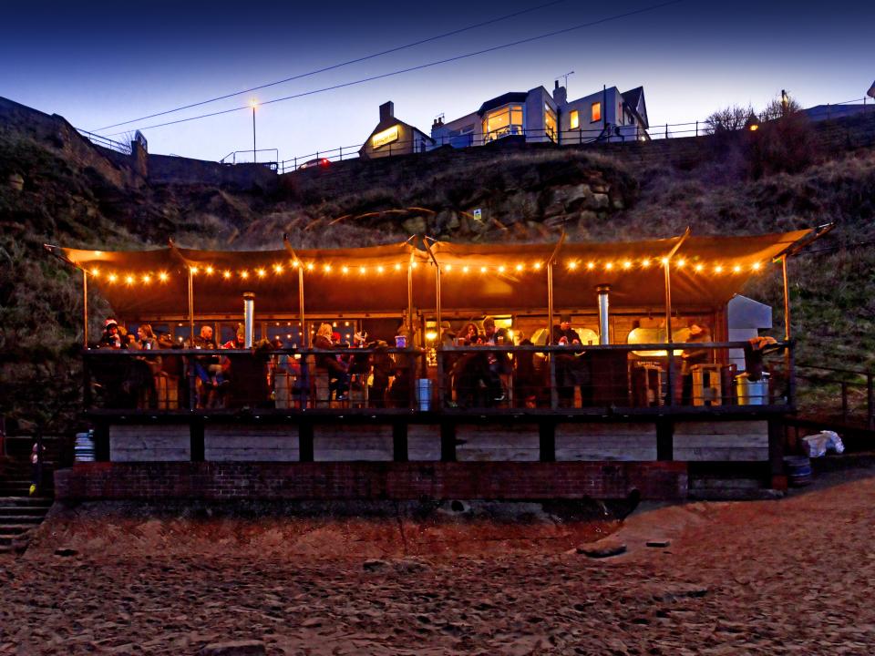 Riley's fish shack sits on the beach and serves fish and chips to visitors