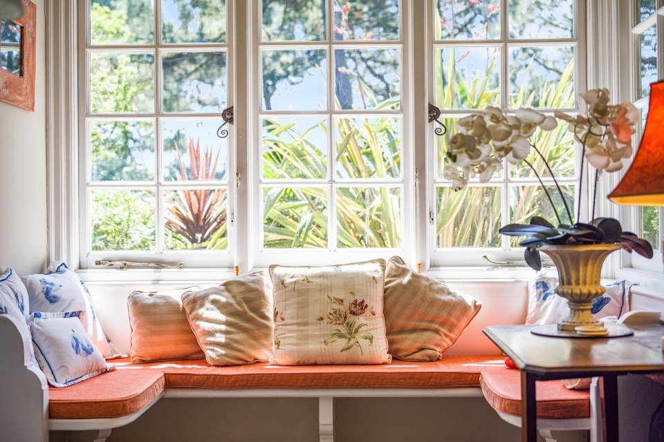 The incredible home is surrounded by clear skies and greenery