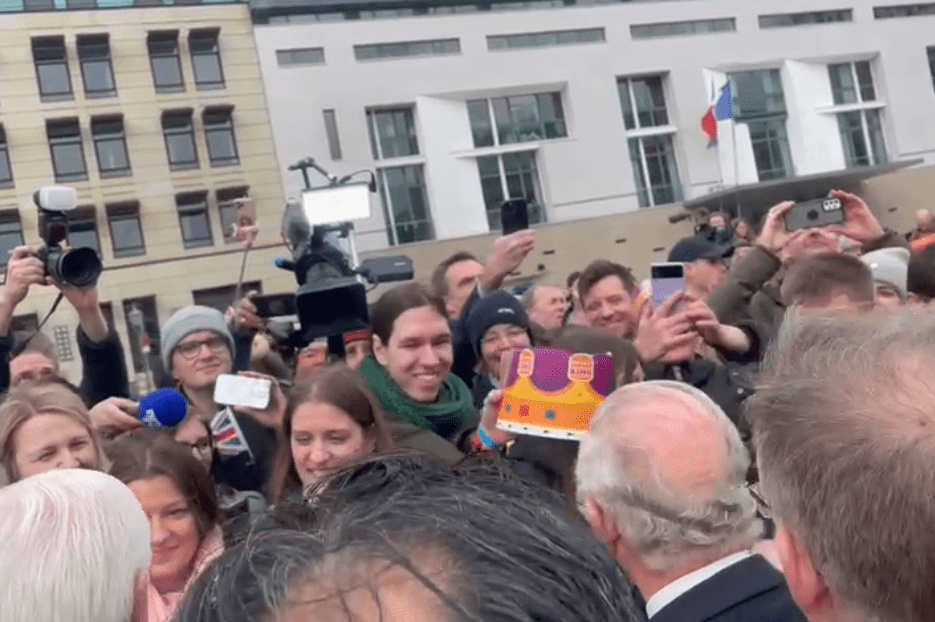 The cheeky fan offered the King a paper crown