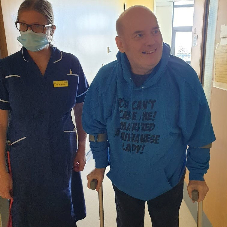 Kevin is recovering from is ordeal, he is pictured above using crutches to walk while a nurse walks beside him