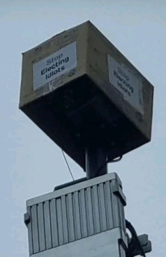 One camera has been covered with a box with 'stop electing idiots' on it