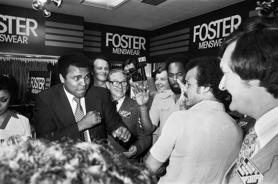 Ali playfully shadow boxes with John Conteh while visiting the Bull Ring Shopping Centre