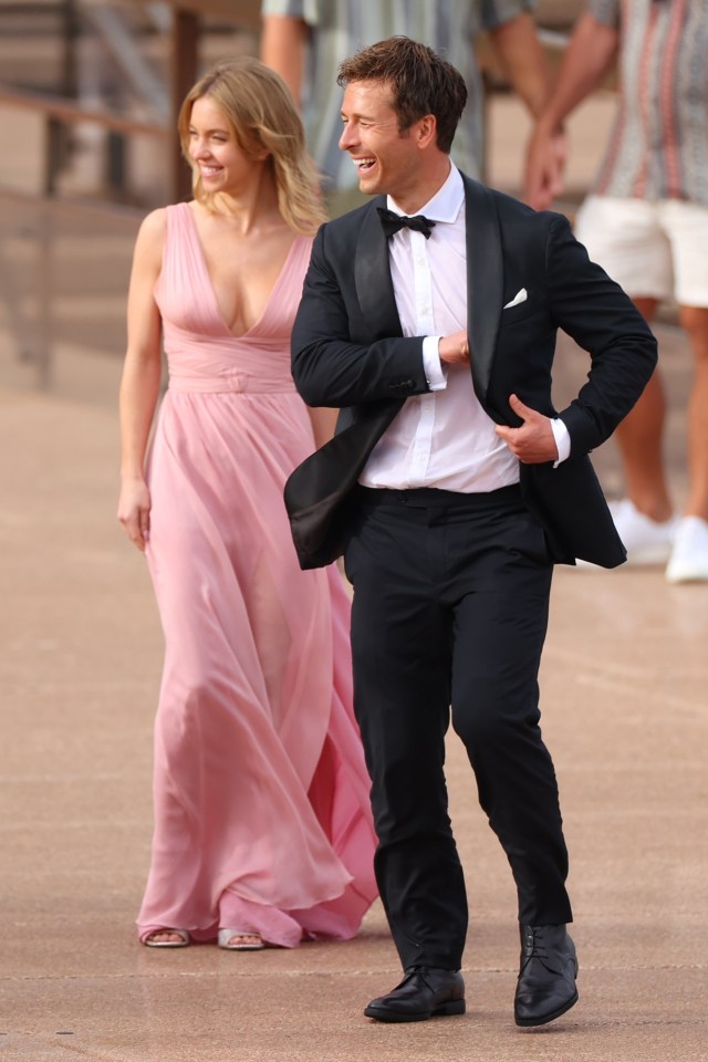 Sydney and co-star Glen Powell filming a mystery project in front of the Sydney Opera House, Australia