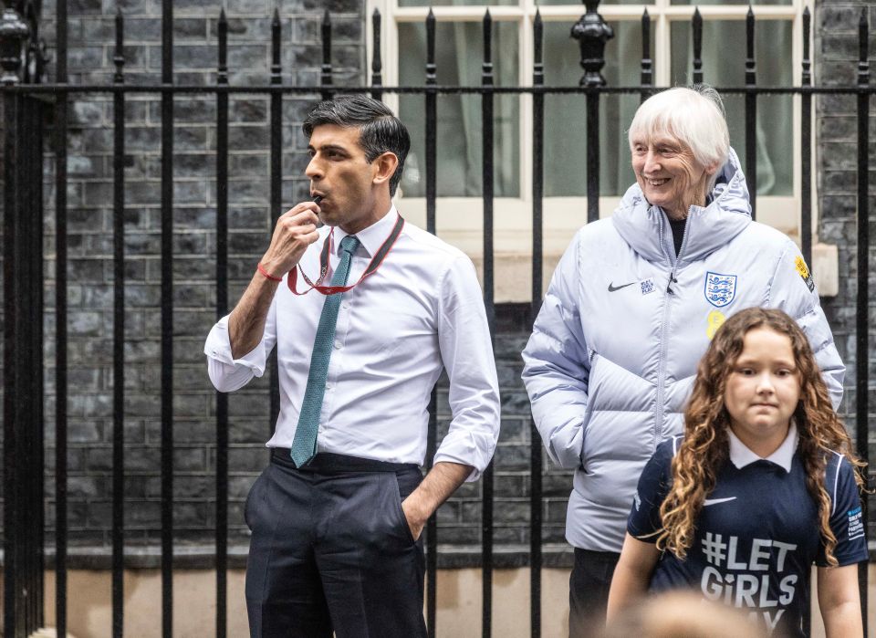 Prime Minister Rishi Sunak blows a whistle as he hosts current and former members of England women’s football team