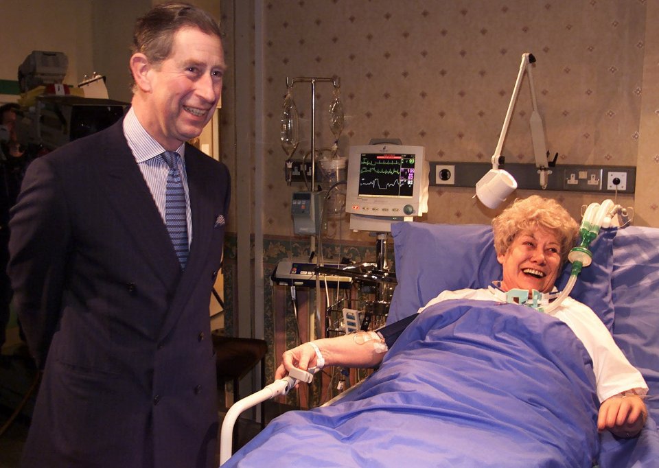 Charles shares a joke with character Vera Duckworth on a royal tour of Coronation Street - the footage was later incorporated in the soap