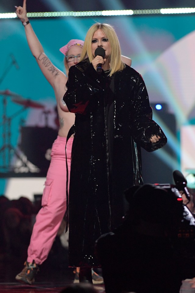 Avril, 38, was dressed in her signature black attire with poker-straight blonde hair at the Juno Awards