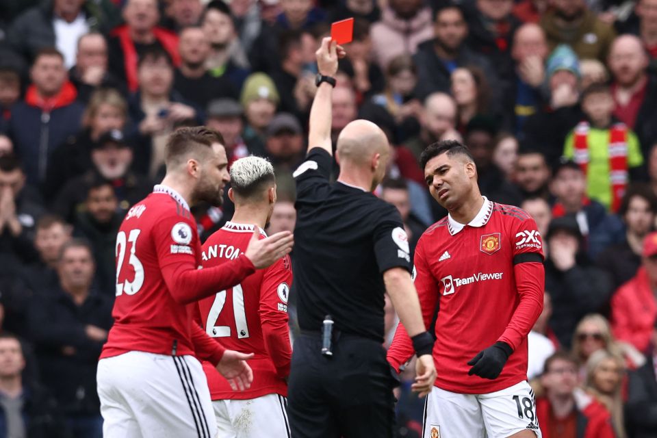 Casemiro looks on after being sent off