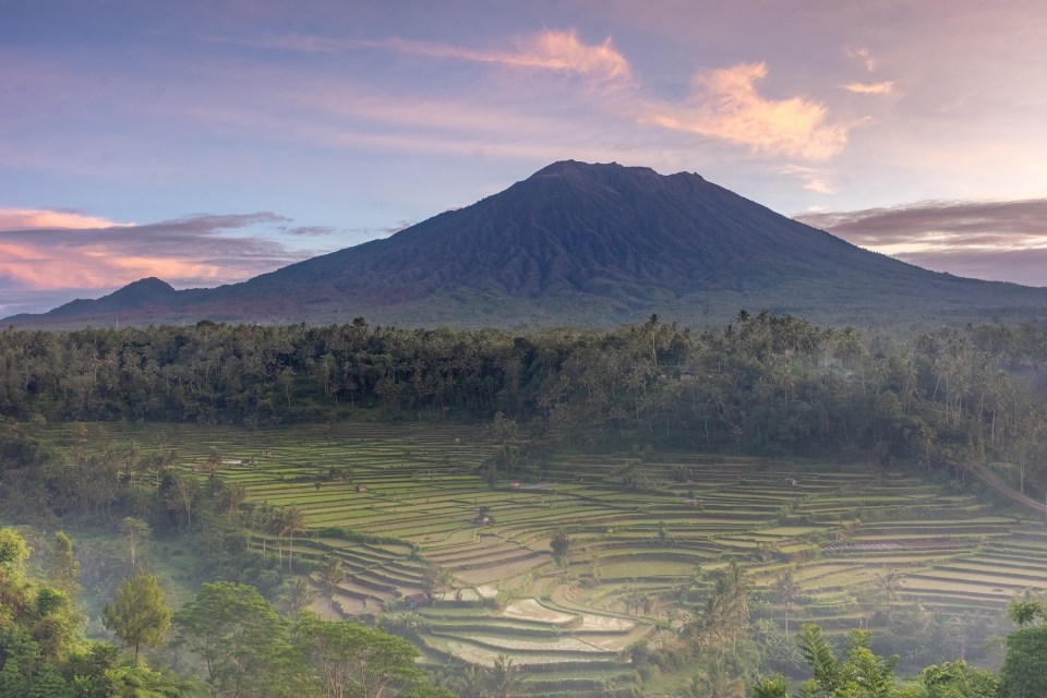 A Russian tourist, Yuri, faced backlash after posing semi-naked on Mount Agung