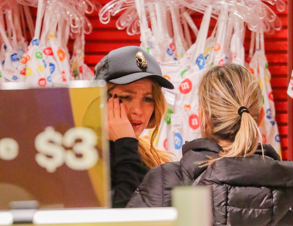 Shakira appeared to cry as she spoke to a woman in New York's M&M store