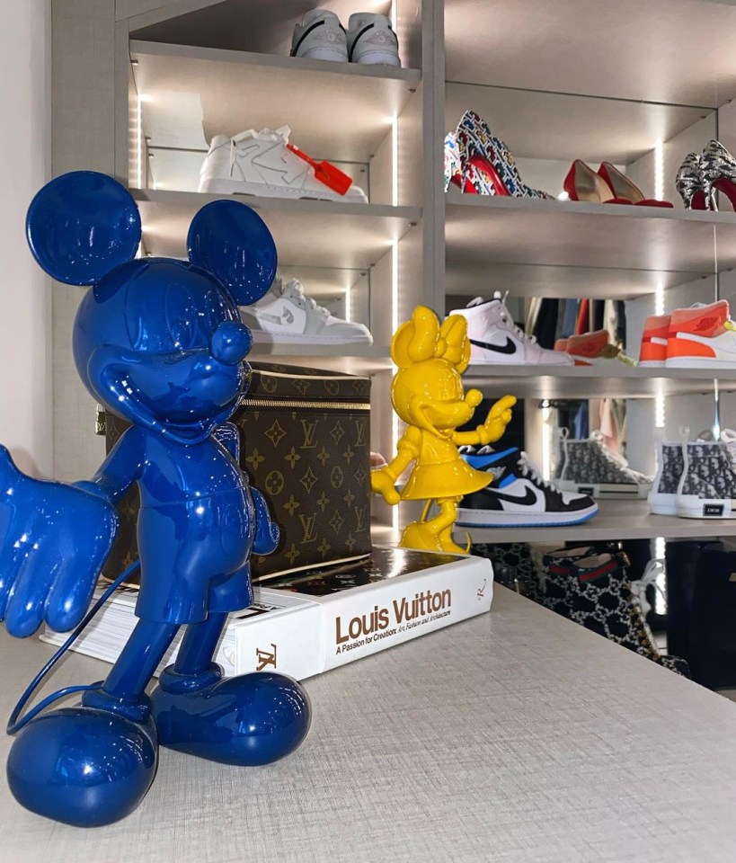 Olivia also has large Mickey and Minnie Mouse sculptures alongside a shoe display cabinet