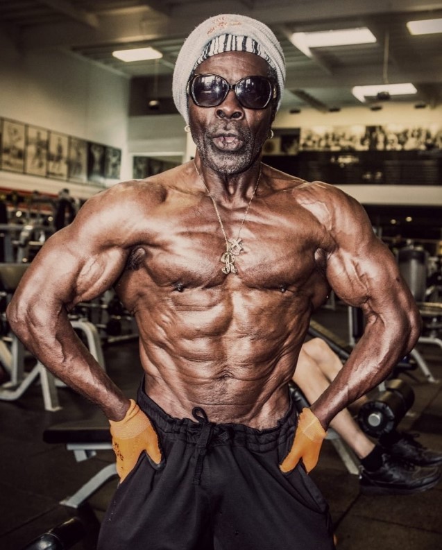 Bodybuilder Robby Robinson at 76 flexing for the camera