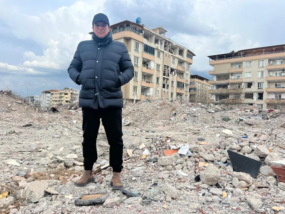 Tamer Hassan in the rubble of the Turkish town of Nurdagi