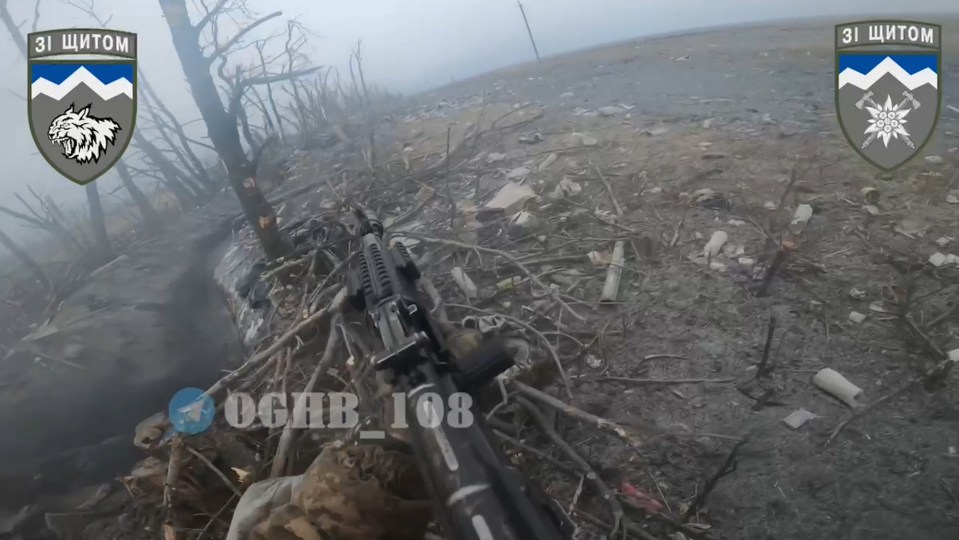 Footage taken from a Ukrainians soldier's helmet shows an assault on a trench