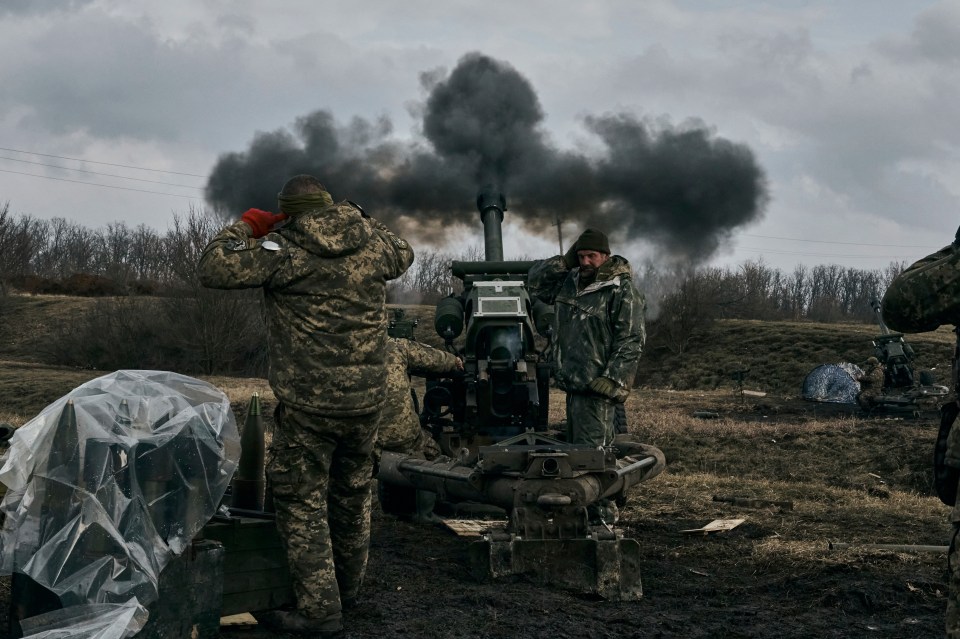 Ukrainian soldiers firing towards Russian positions