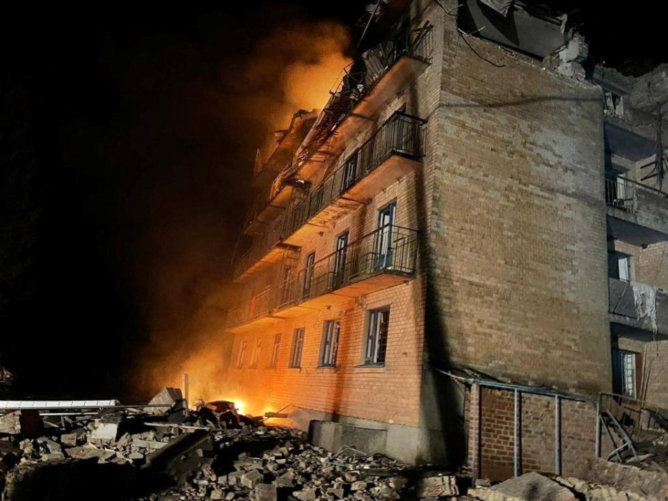 A building on fire as a result of a Russian attack in the town of Rzhyshchiv, in Kyiv region