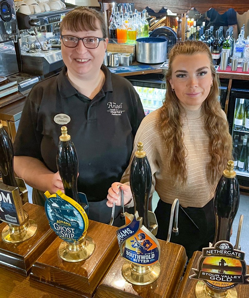 Lindsay Bray and Millie Cooper working behind the bar at The Angel